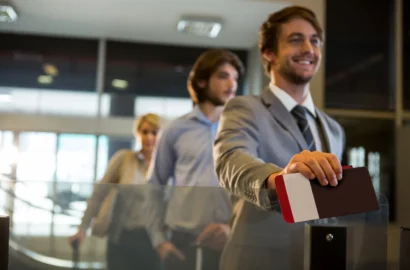 businessman-standing-with-boarding-pass-check-counter_107420-63615 businessman-standing-with-boarding-pass-check-counter_107420-63615